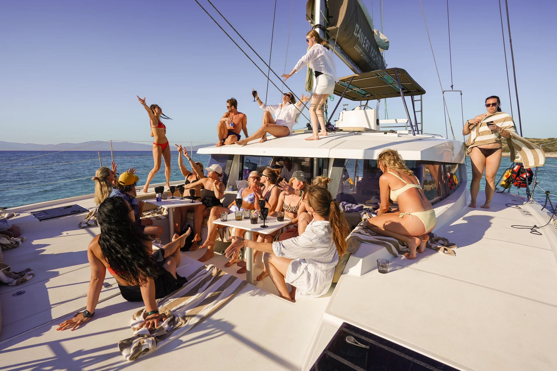 Friends enjoying a sunny day aboard a DanEri catamaran