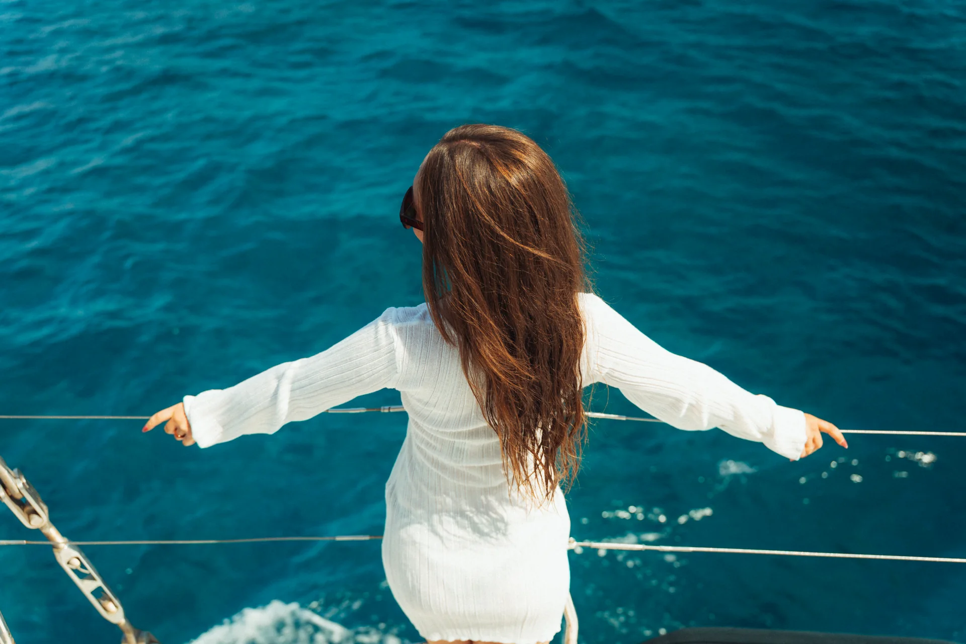 Guest enjoying the sea breeze on a Rhodes cruise
