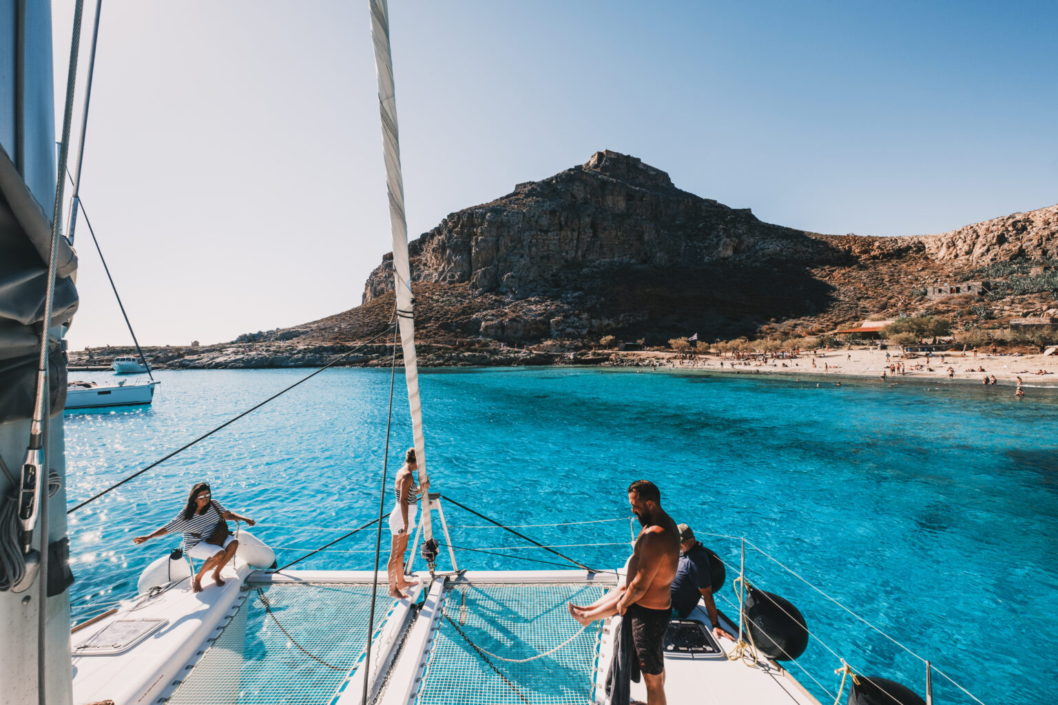 Catamaran departing Kissamos Port for sunset cruise to Balos