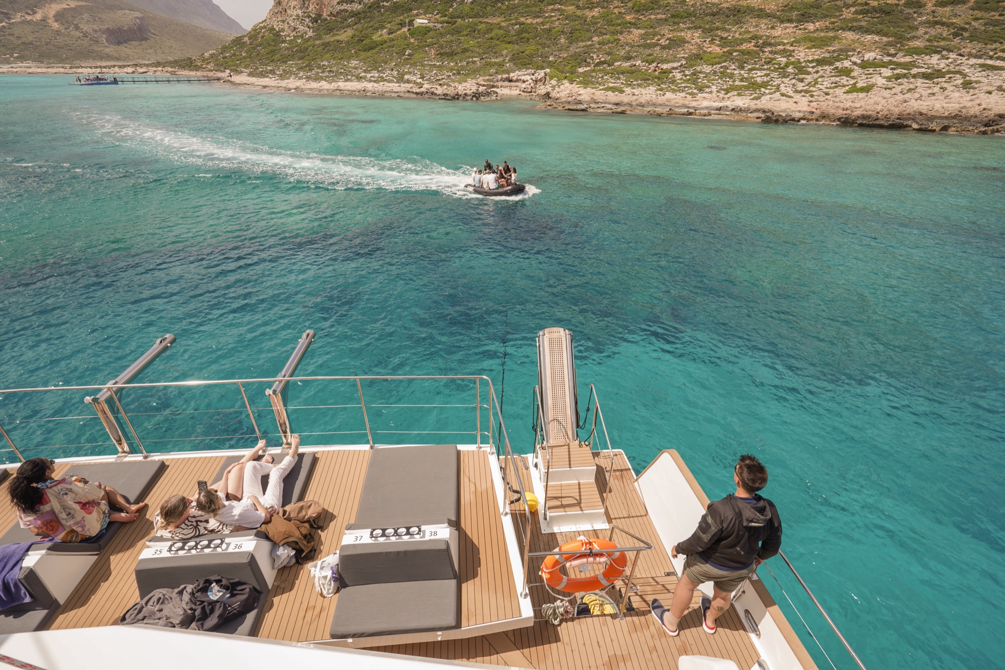 A tender crossing the turquoise Balos lagoon from a DanEri catamaran on a day trip from the Chania area