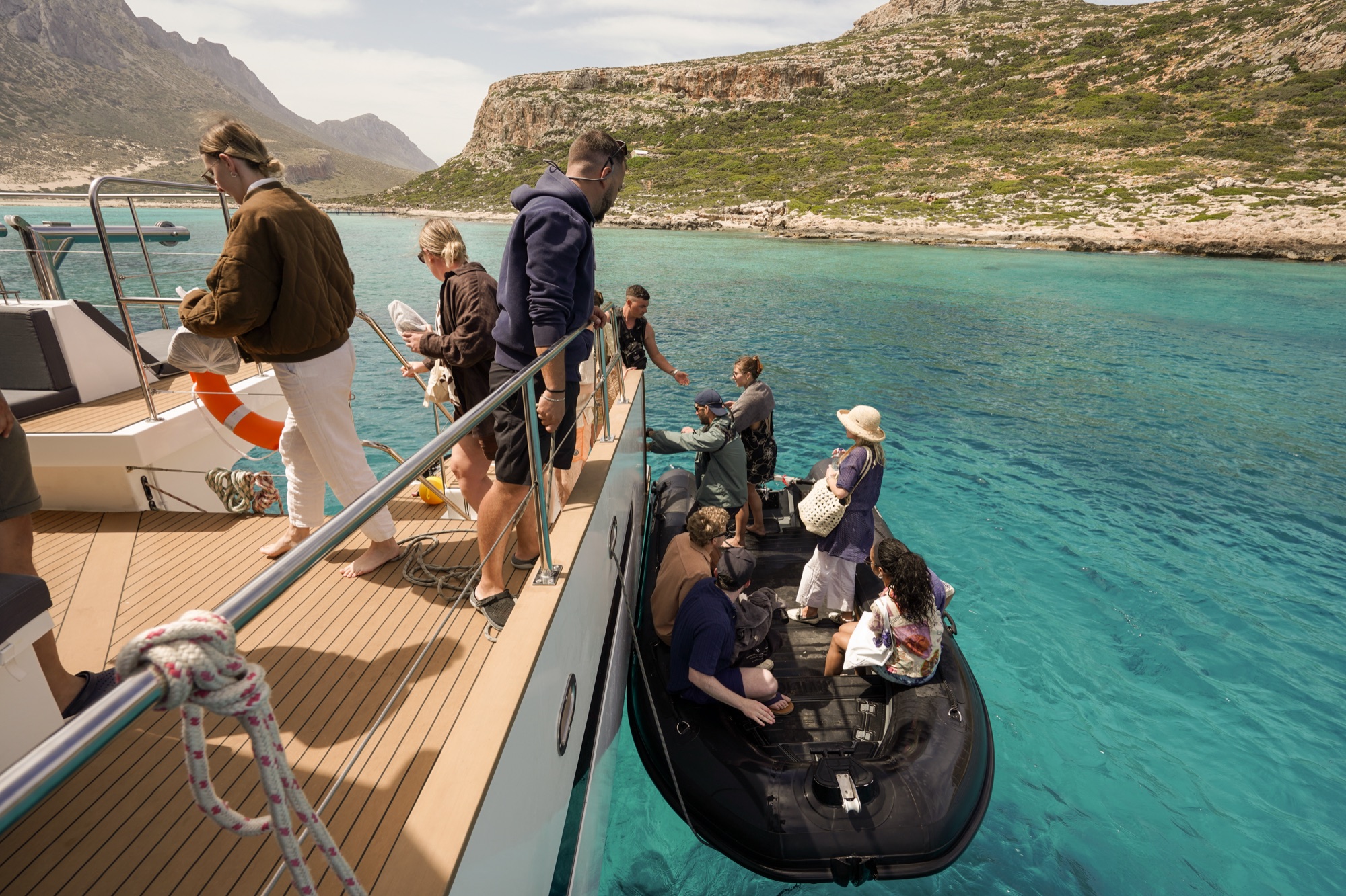 Guests boarding the tender from a DanEri catamaran to land at Balos and Gramvousa