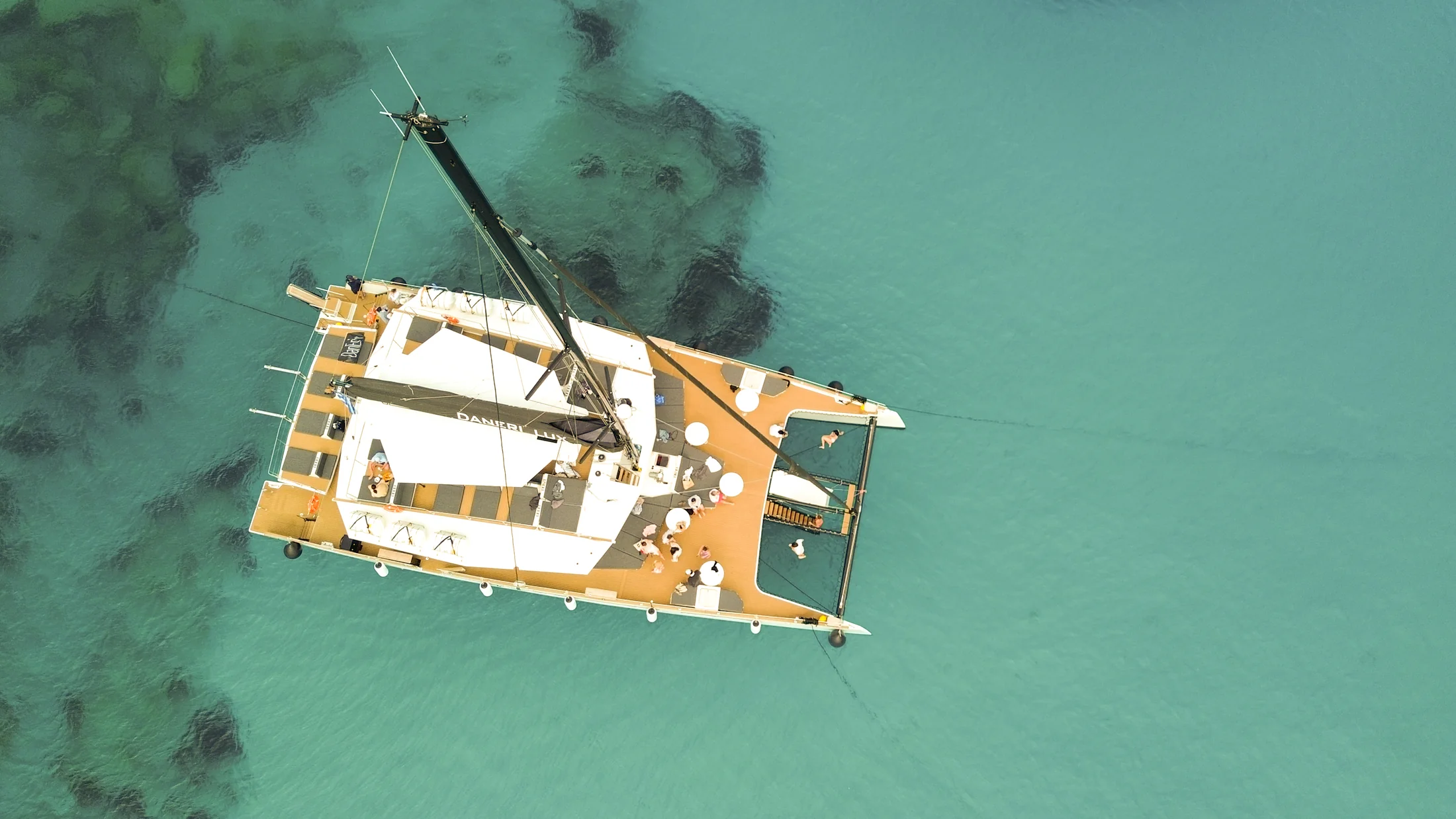 Aerial view of DanEri Lux in turquoise water